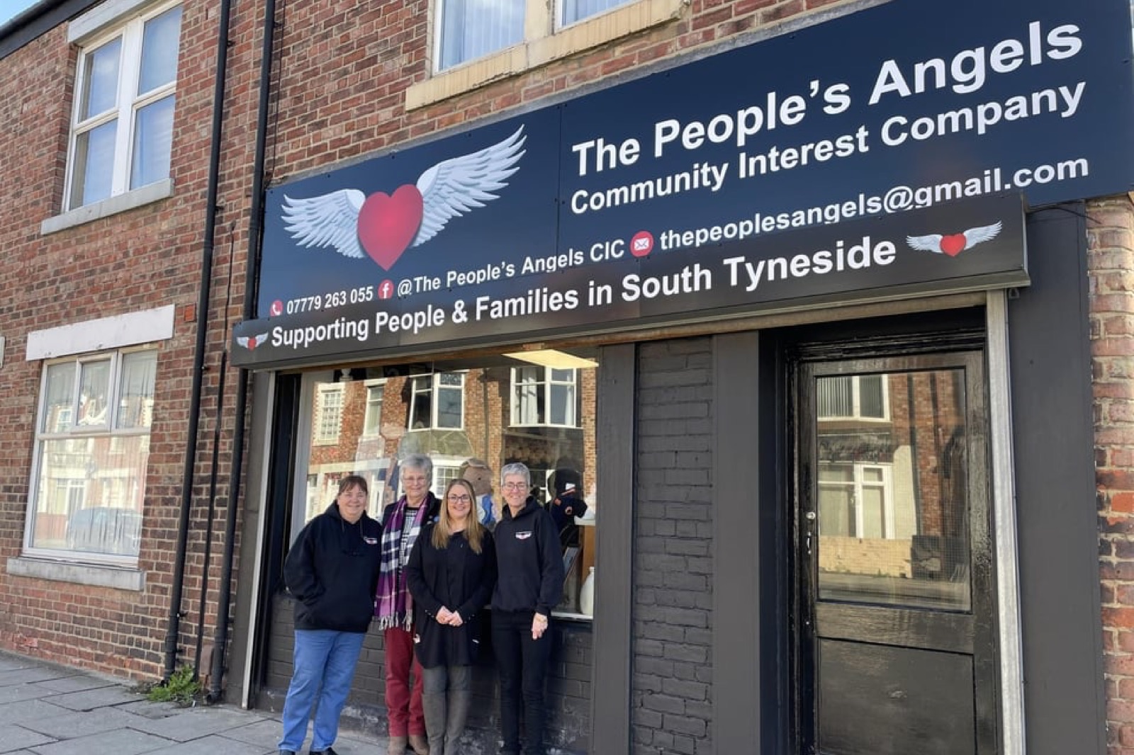 The People's Angels shop front on Boldon Lane, South Shields, with the team stood outside